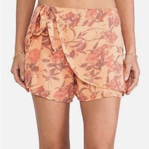 Free people orange floral wrap shorts